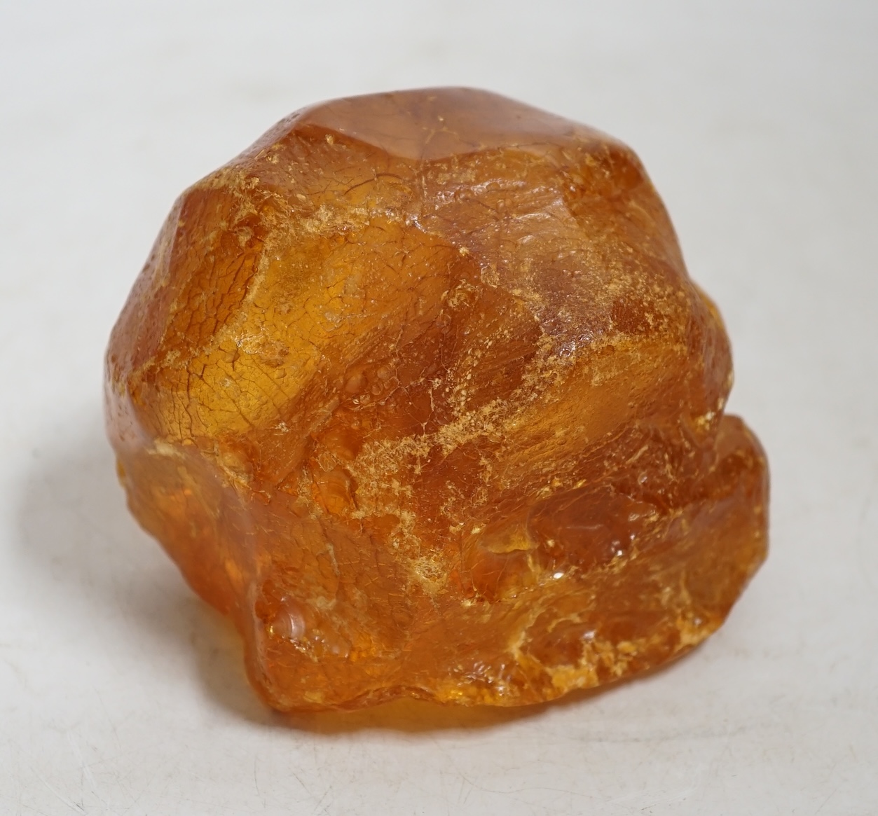 A section of natural amber, approximately 11.5cm wide. Condition - fair